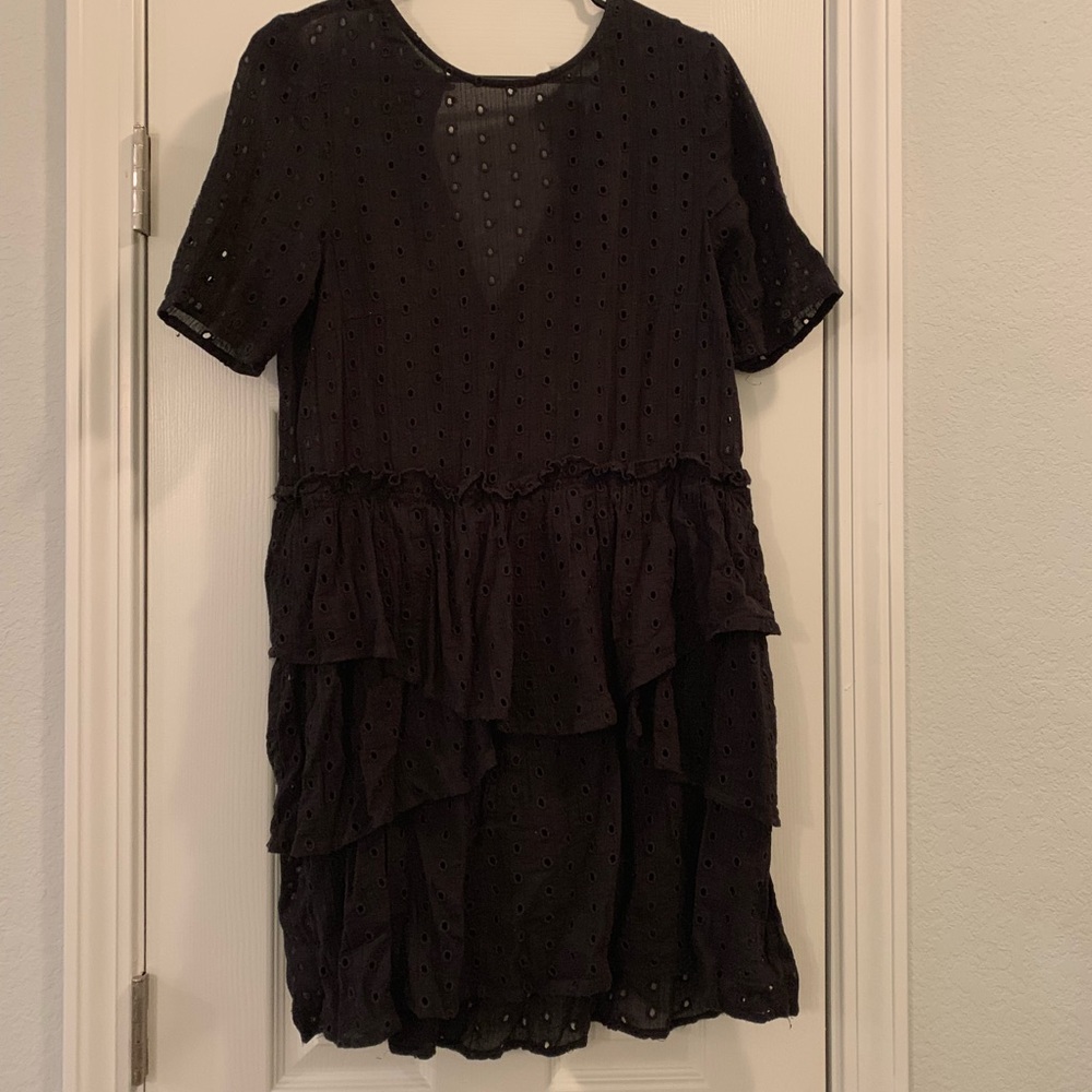 Black poka dot shirt.